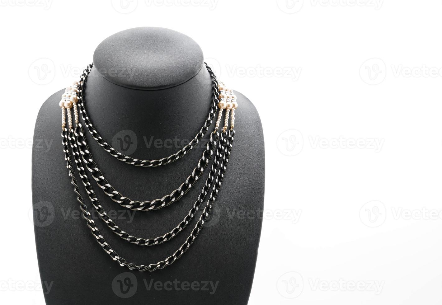 Beautiful and luxury necklace with jewelry stand neck on white photo