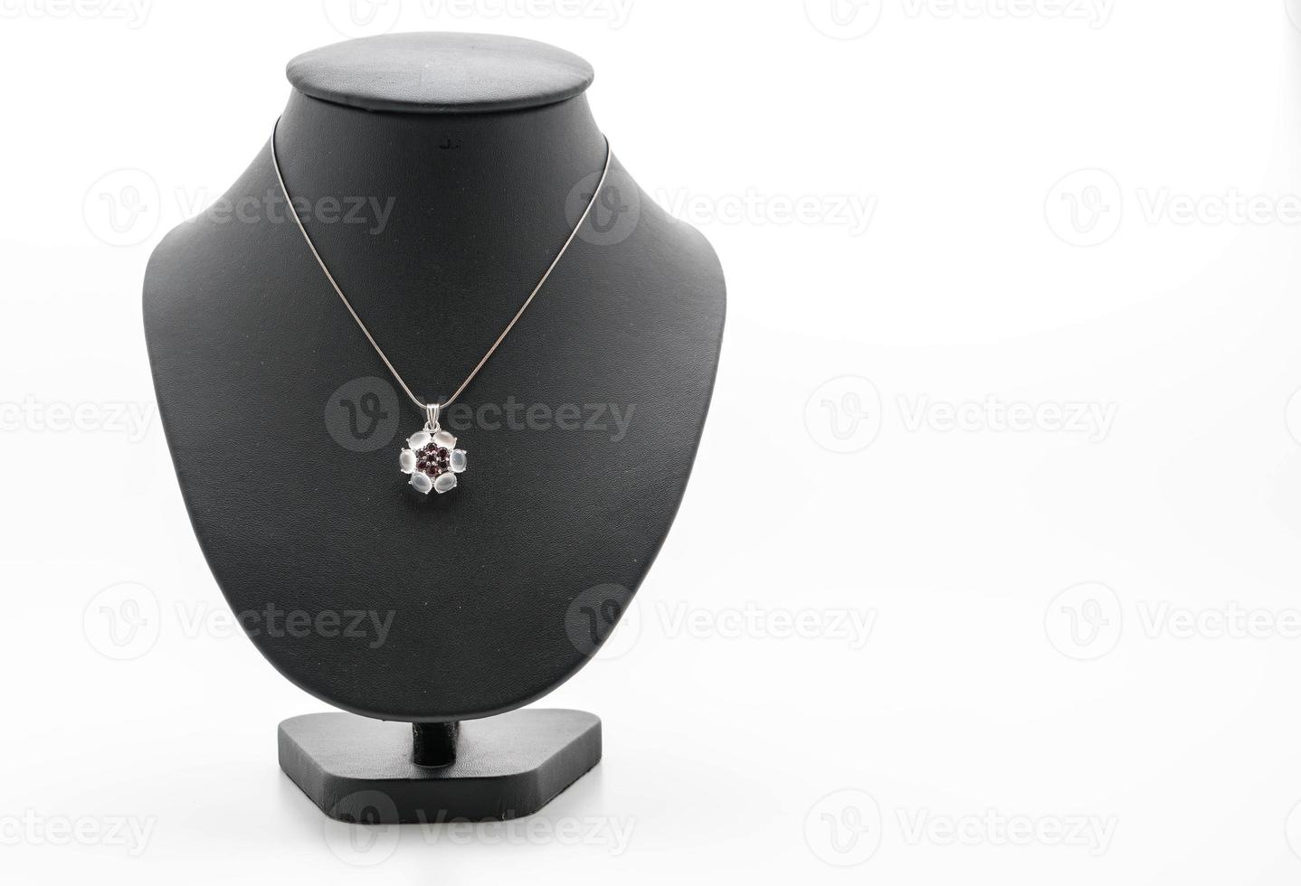 Beautiful and luxury necklace with jewelry stand neck on white photo