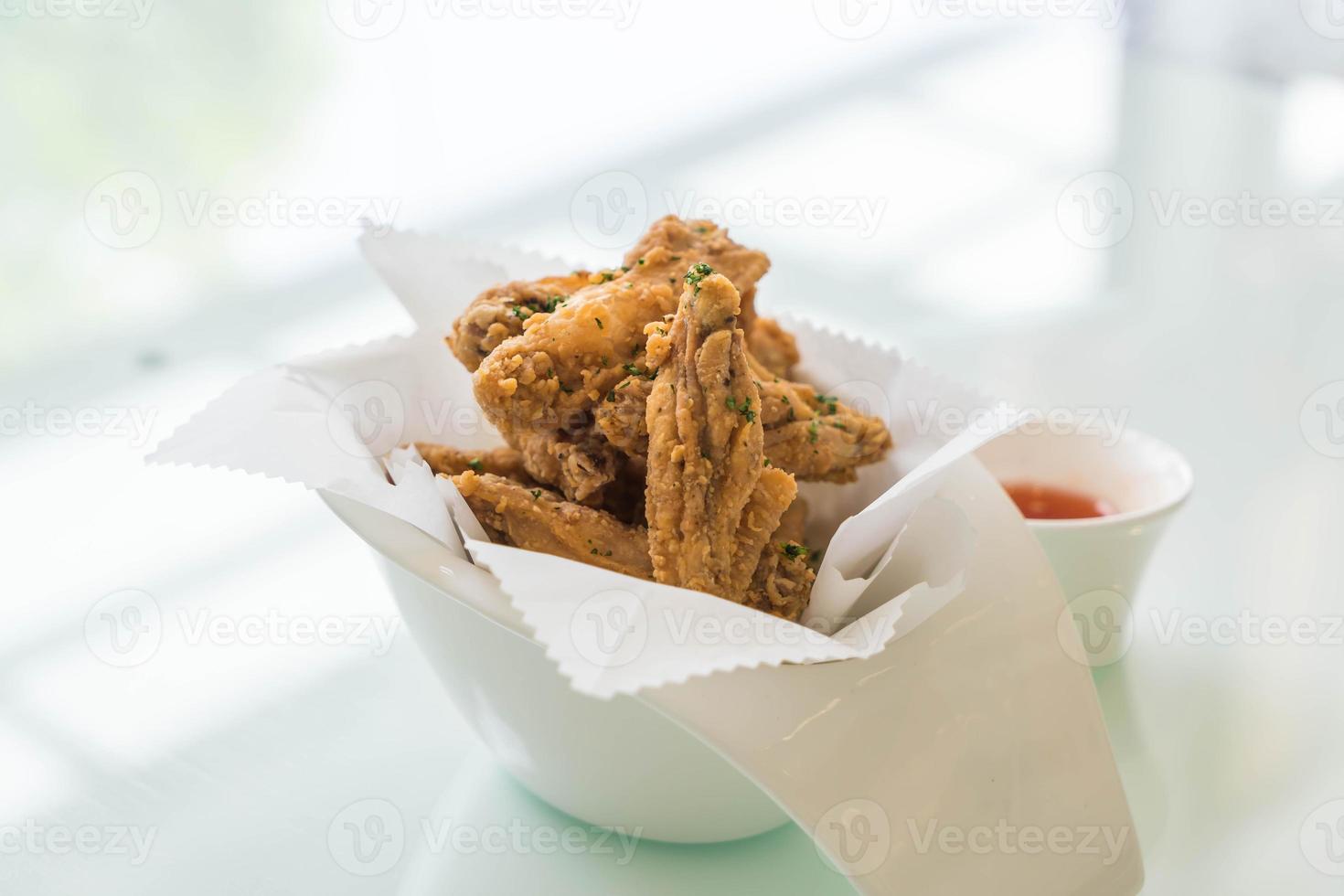 Fried chicken wings with sauce photo