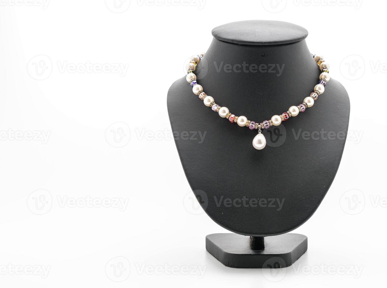 Beautiful and luxury necklace with jewelry stand neck on white photo