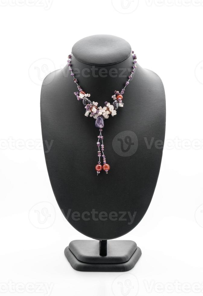 Beautiful and luxury necklace with jewelry stand neck on white photo