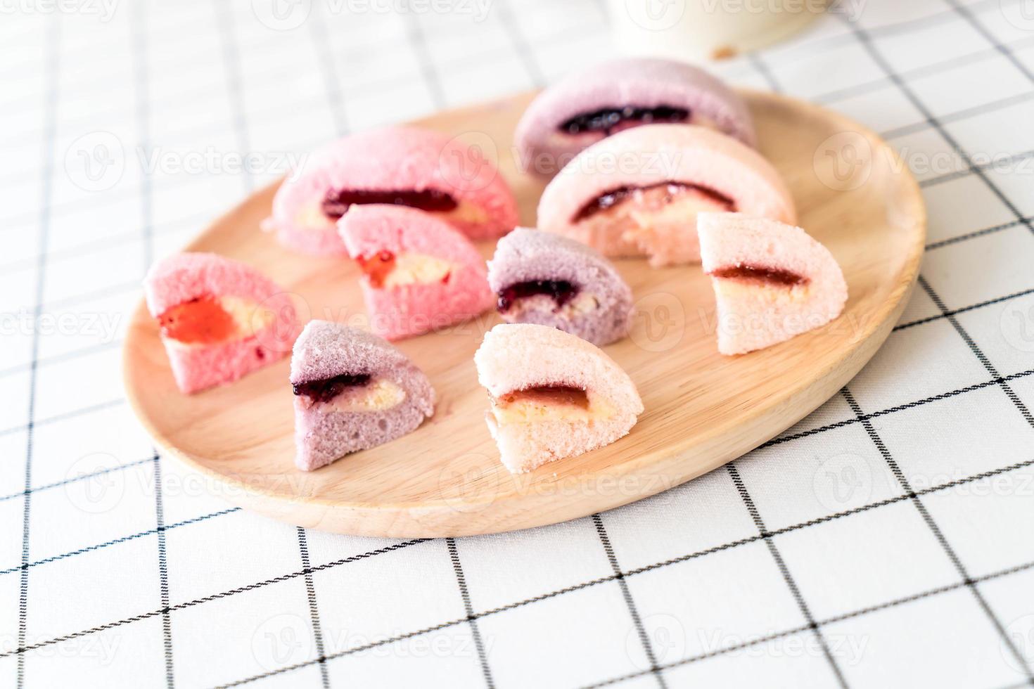 Mulberry, blueberry, and strawberry fruit cake on table photo