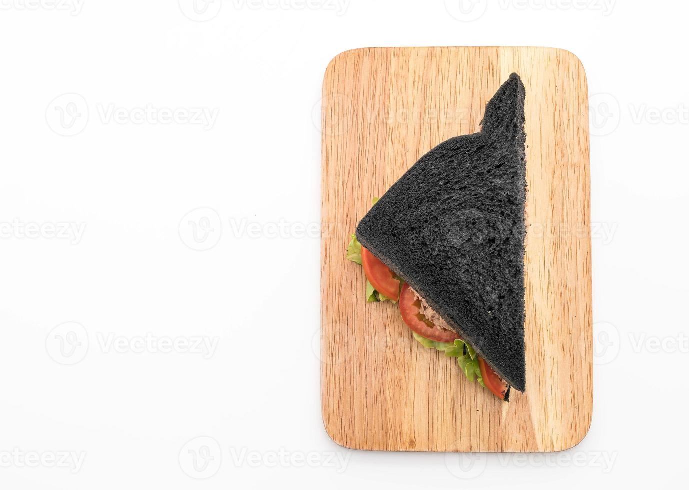 Tuna charcoal sandwich on white background photo