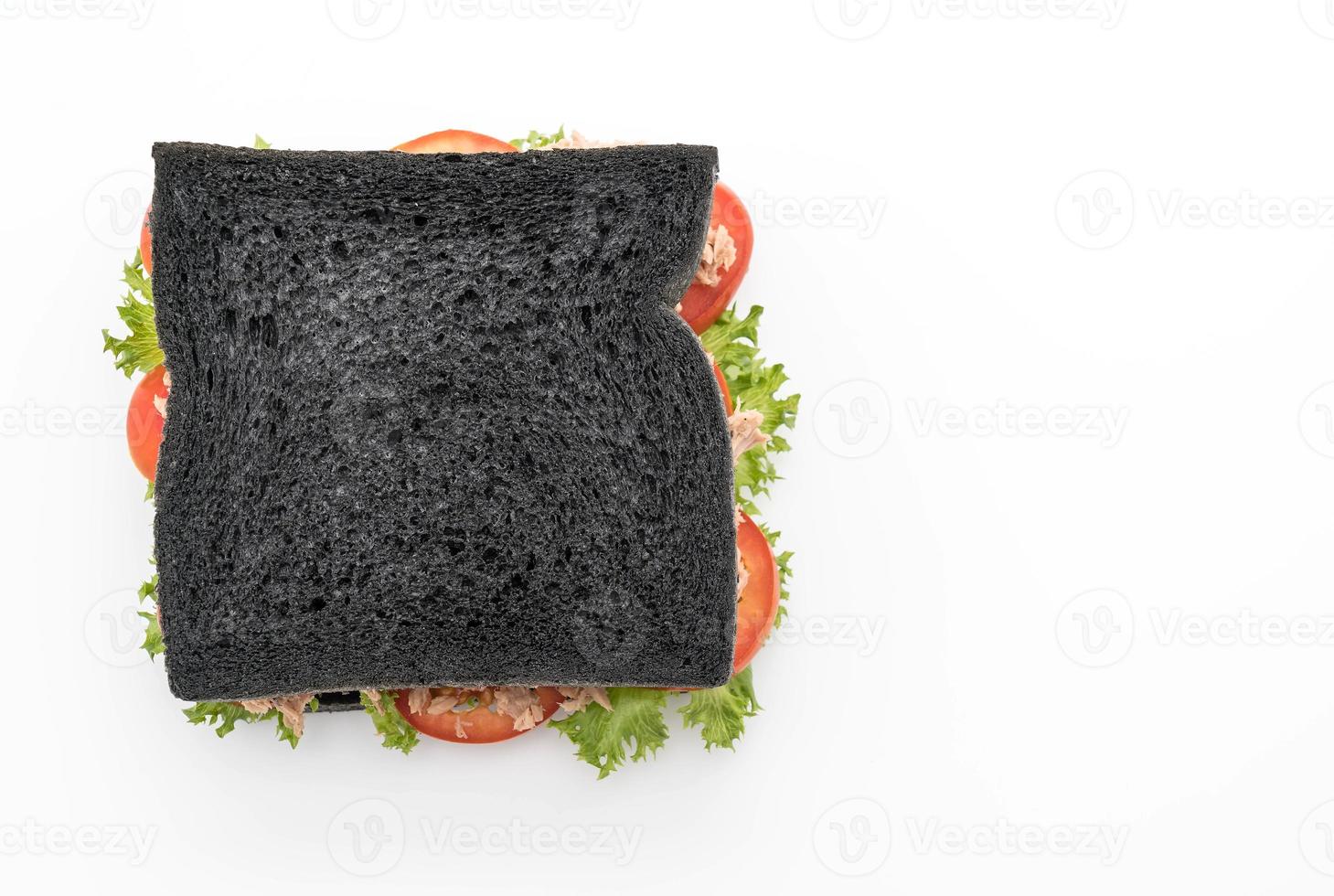 Tuna charcoal sandwich on white background photo