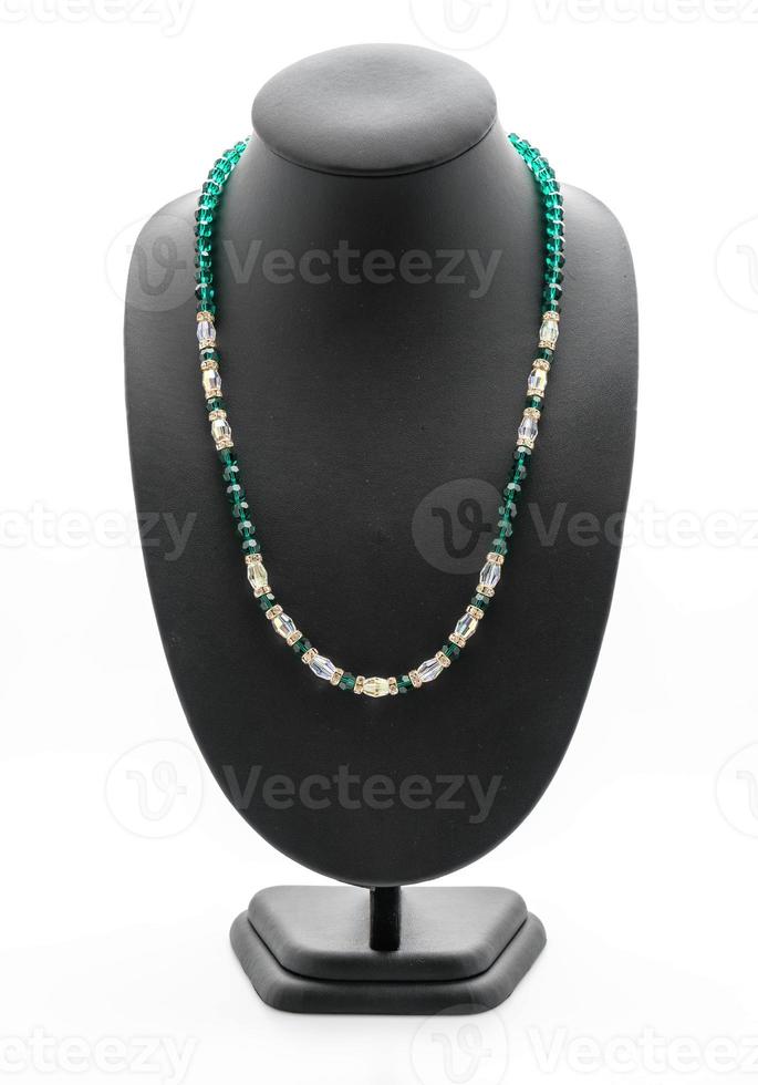 Beautiful and luxury necklace with jewelry stand neck on white photo