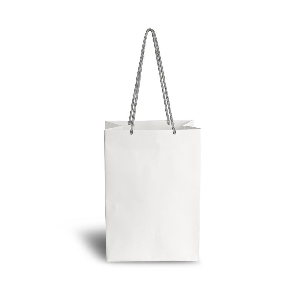 White paper shopping bag side view isolated on white background photo