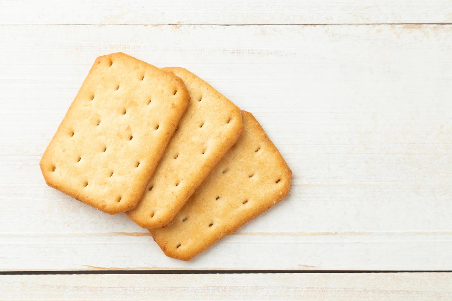 Cracker cookies on wooden table background photo