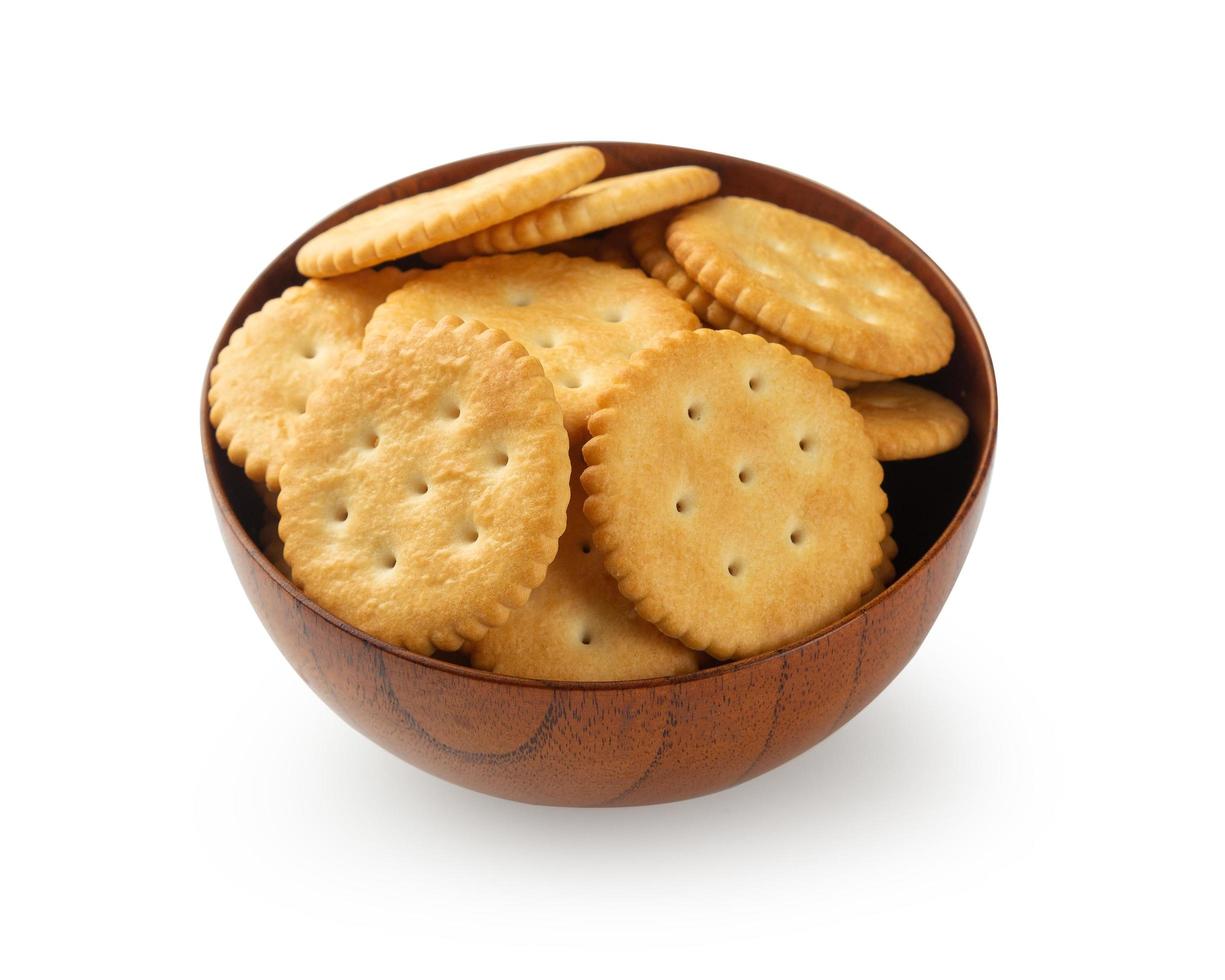 Cracker cookies in wooden bowl isolated on white background photo