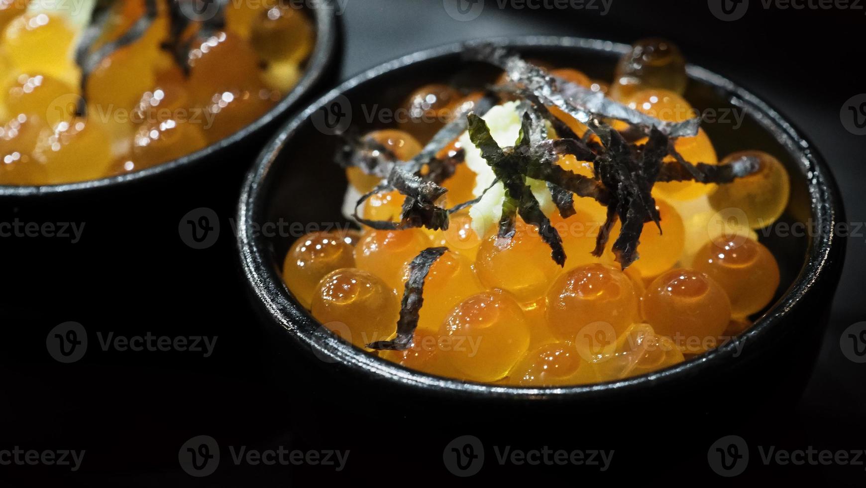 Ikura roe. Salmon Ikura Roe Served with rice and top with seaweed photo