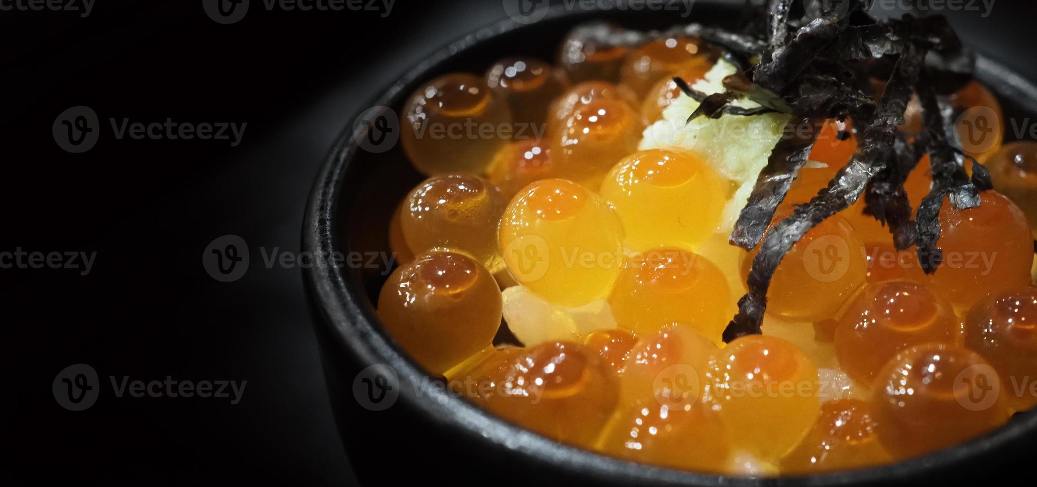 Ikura roe. Salmon Ikura Roe Served with rice and top with seaweed photo