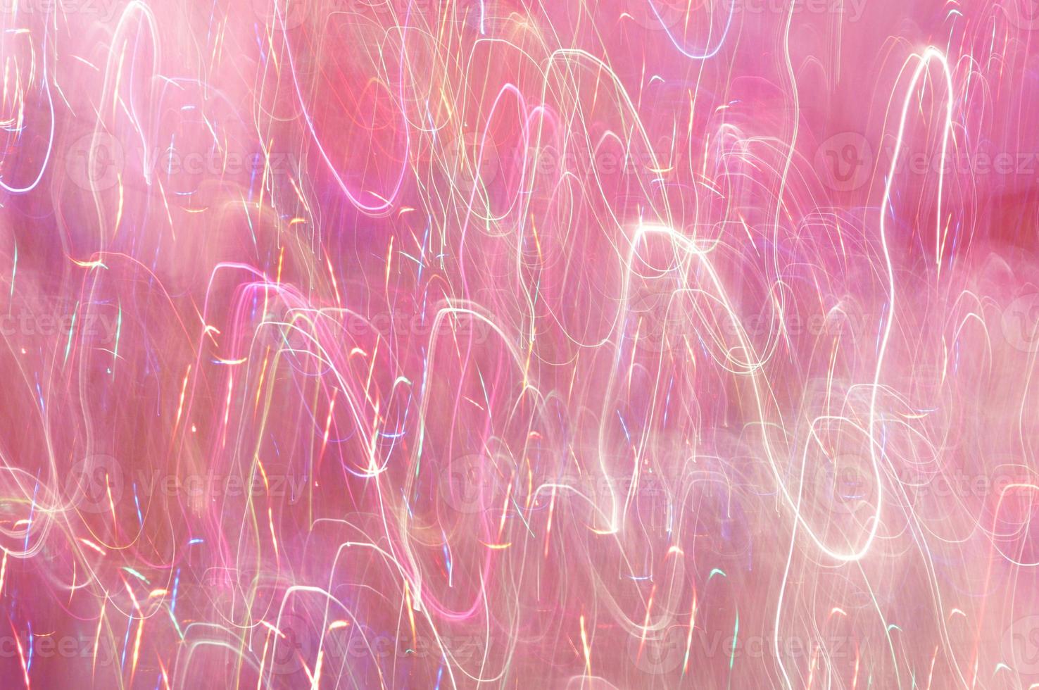 Abstract background of lights glowing pink with colorful strokes photo