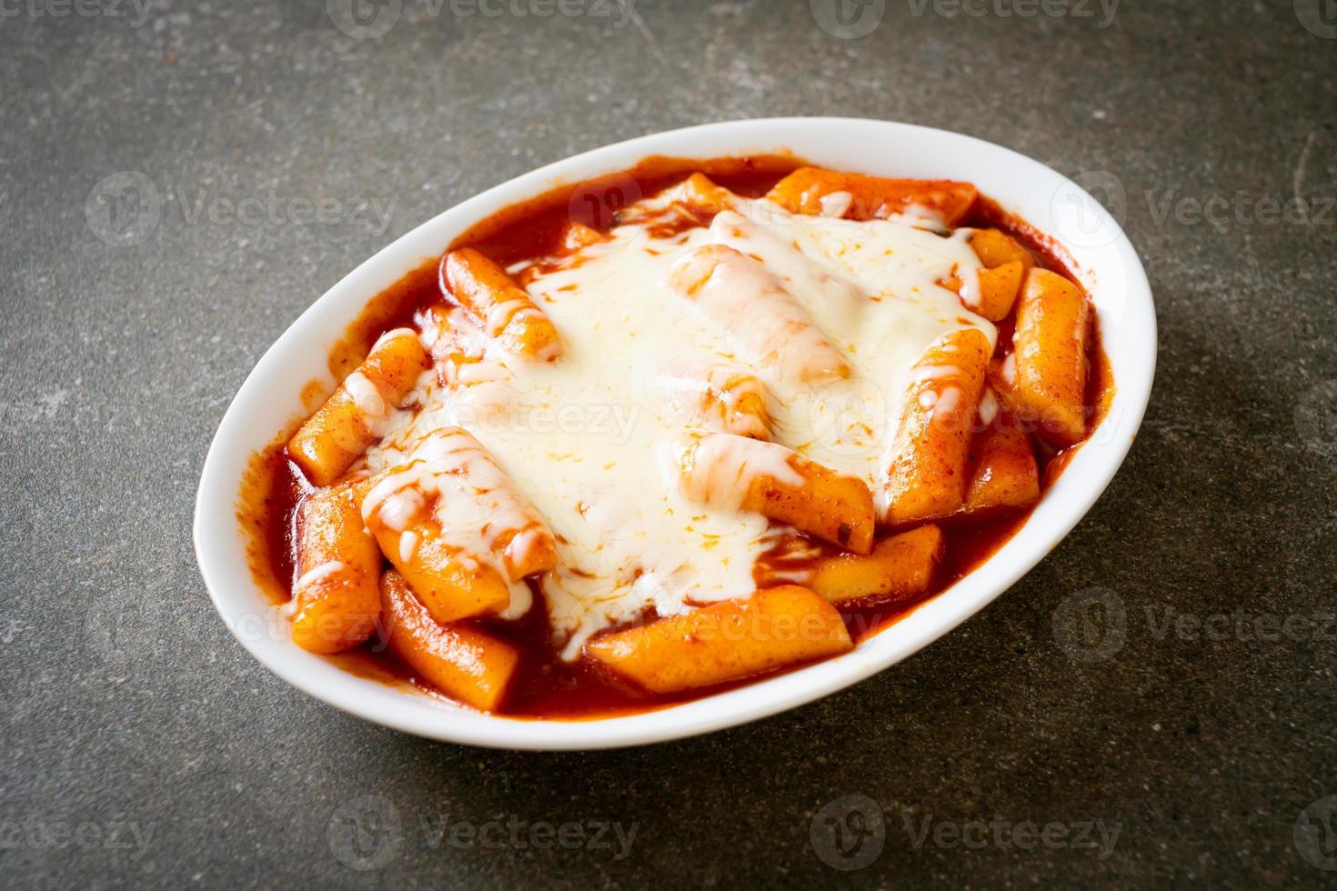 Korean rice cake in spicy Korean sauce with cheese photo