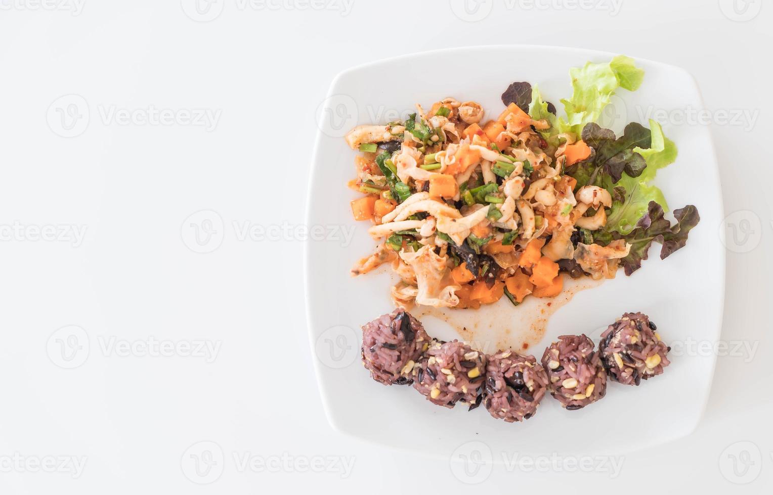 Spicy vegan salad with sticky berry and grain rice photo