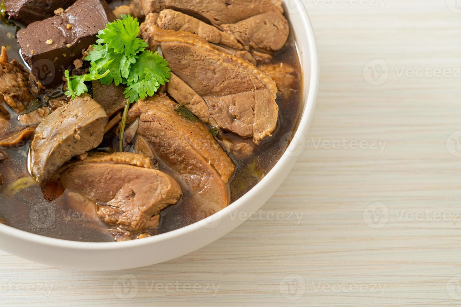 Pot-stewed ducks or Steamed duck with soy sauce and spices photo