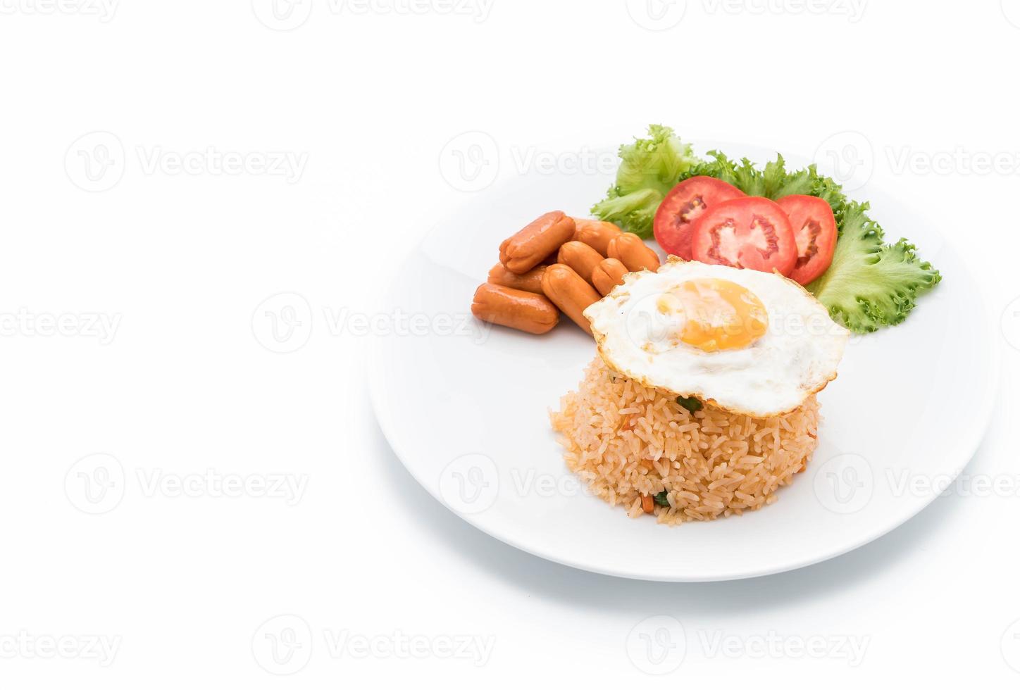 Fried rice with sausage and fried egg on the table photo