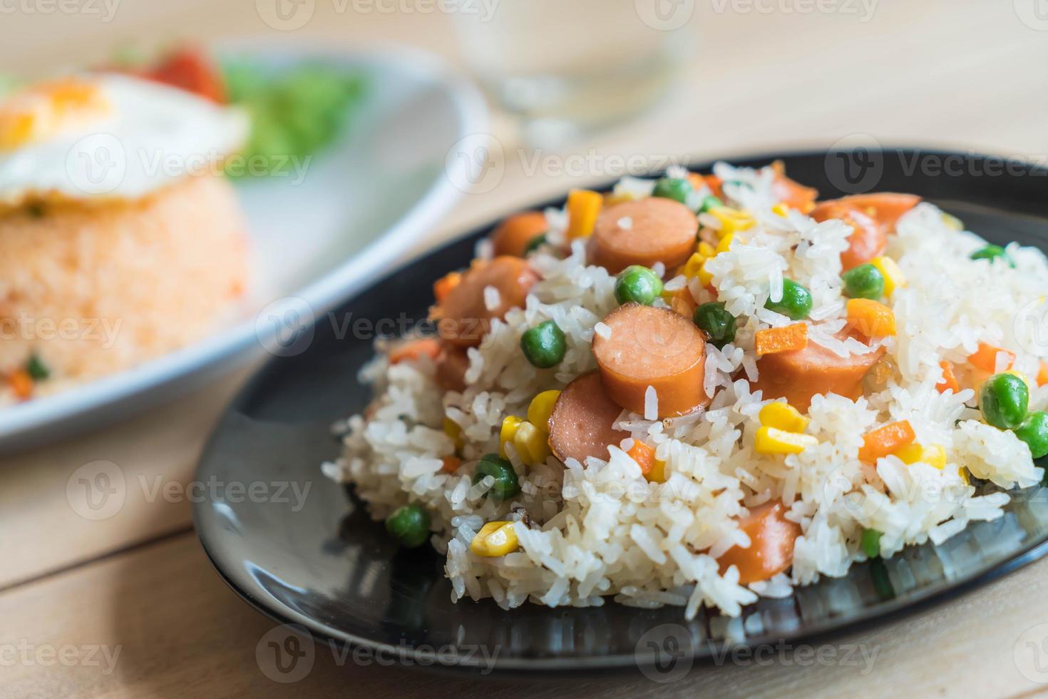 Fried rice with sausage on the table photo