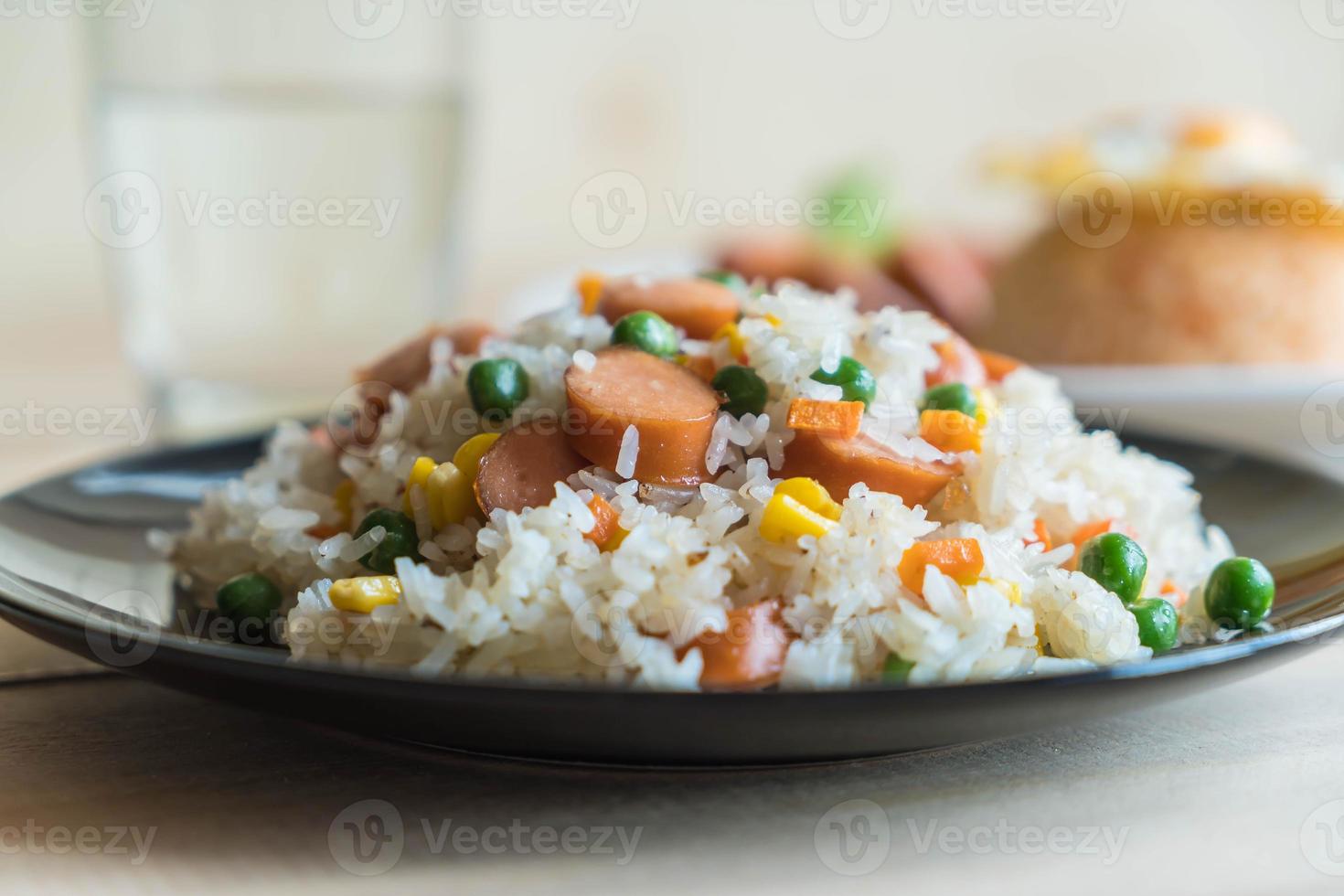 Fried rice with sausage on the table photo