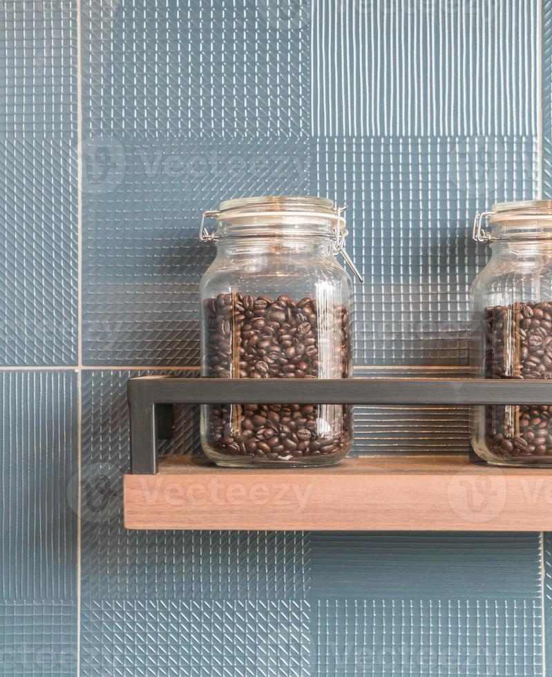 Coffee bean in bottle on shelf photo