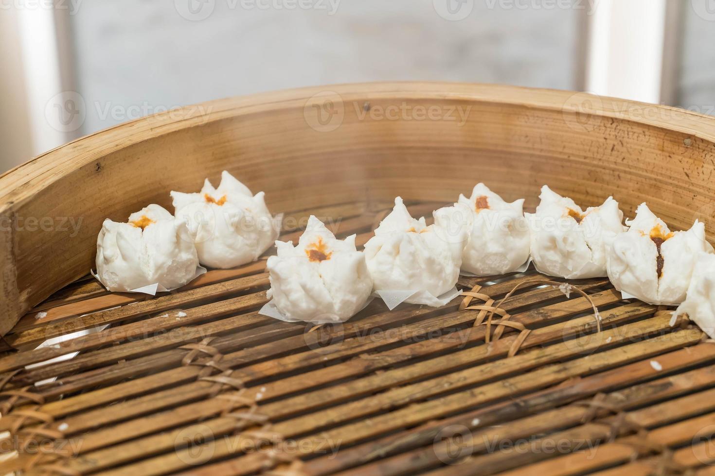 Hot Chinese bun on bamboo dim sum photo