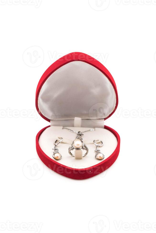 Beautiful and luxury necklace jewely with ring, earrings set in box on white background photo