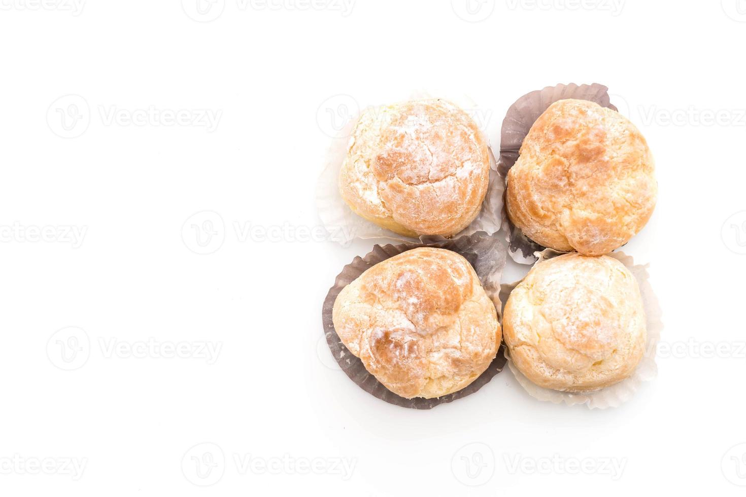 Cream puff on white background photo