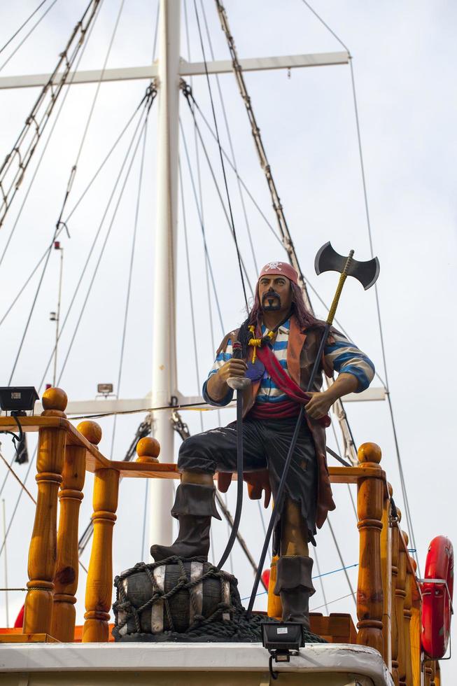 A Pirate Ship and Pirate Statue photo