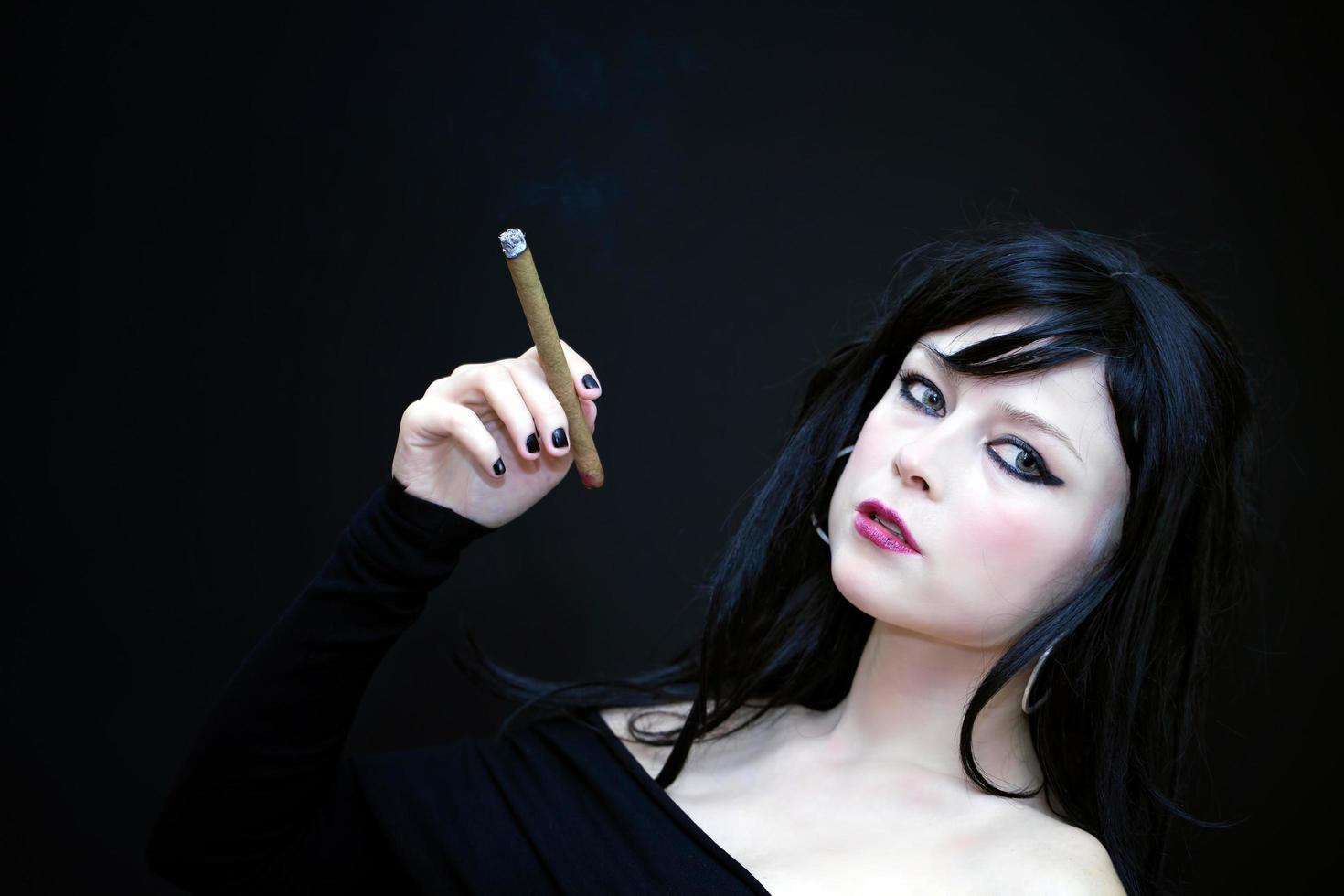 Young Beautiful Woman Smoke Cigarette photo