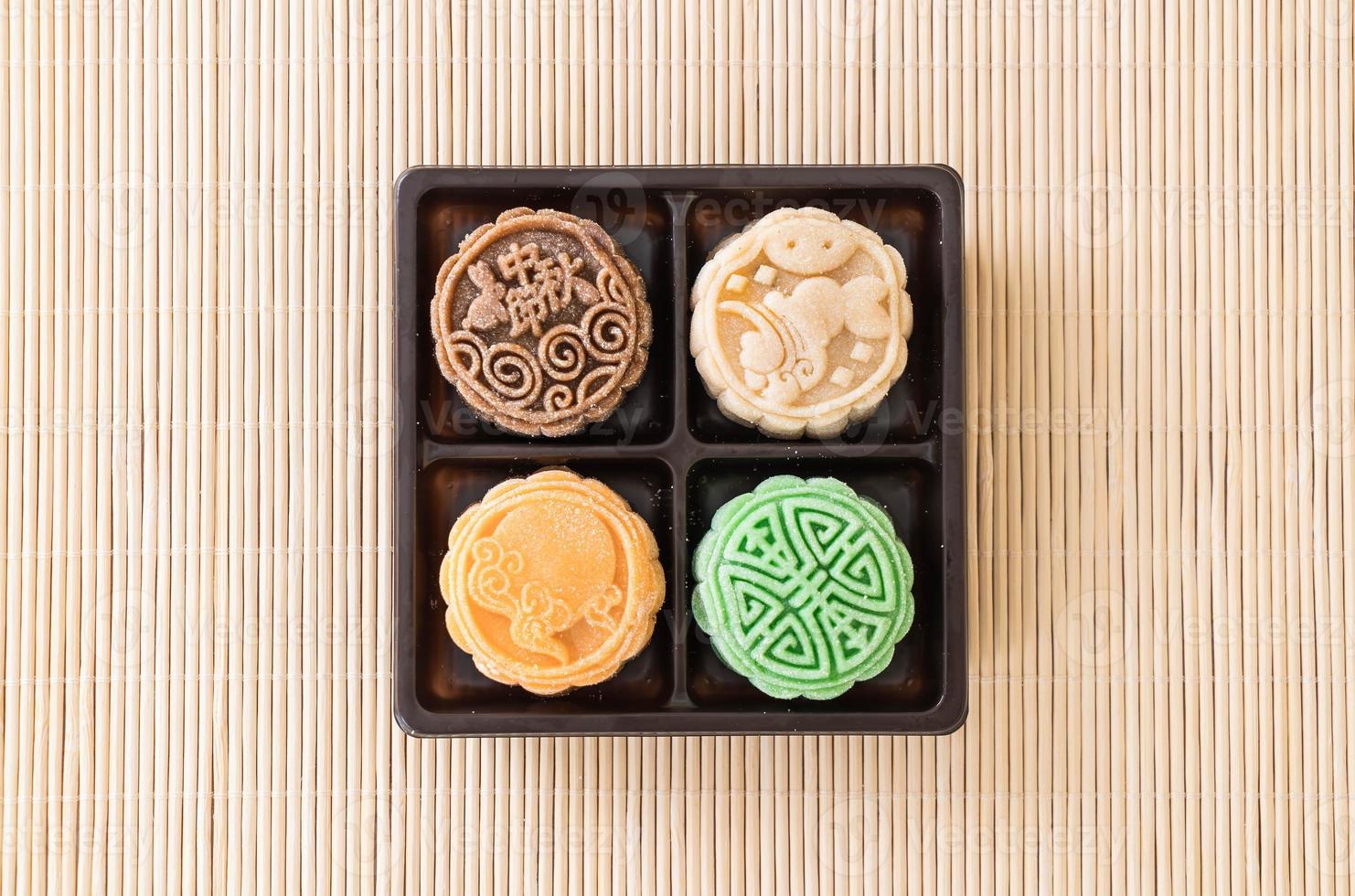 Fresh moon cake on wood plate photo