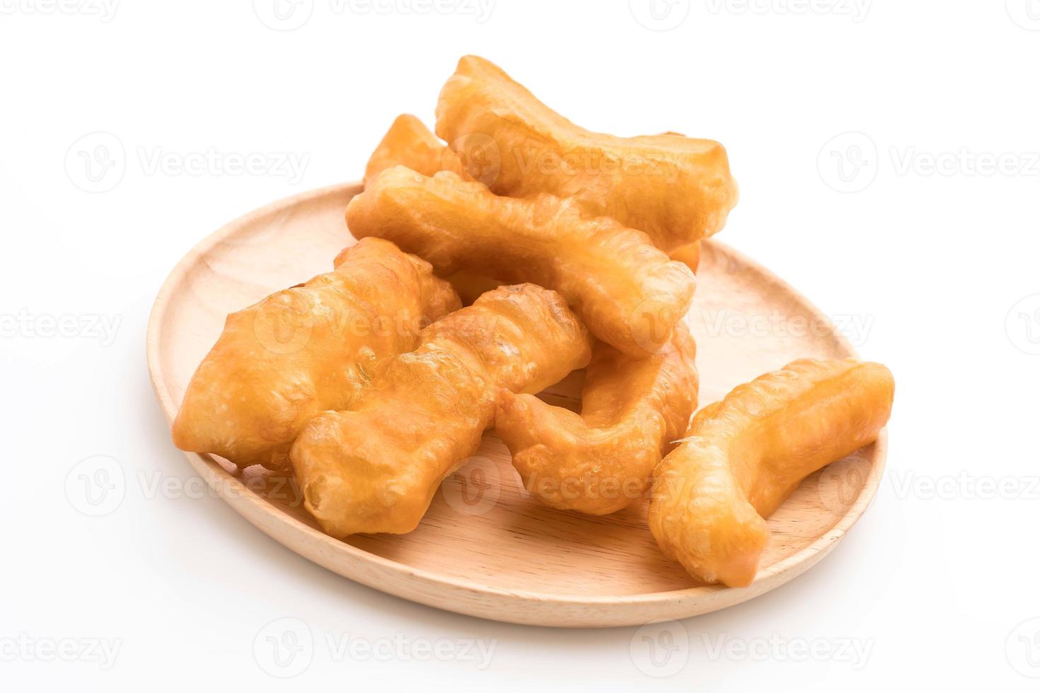 Deep-fried dough stick on white background photo