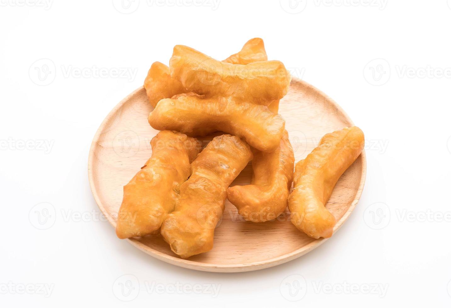 Deep-fried dough stick on white background photo