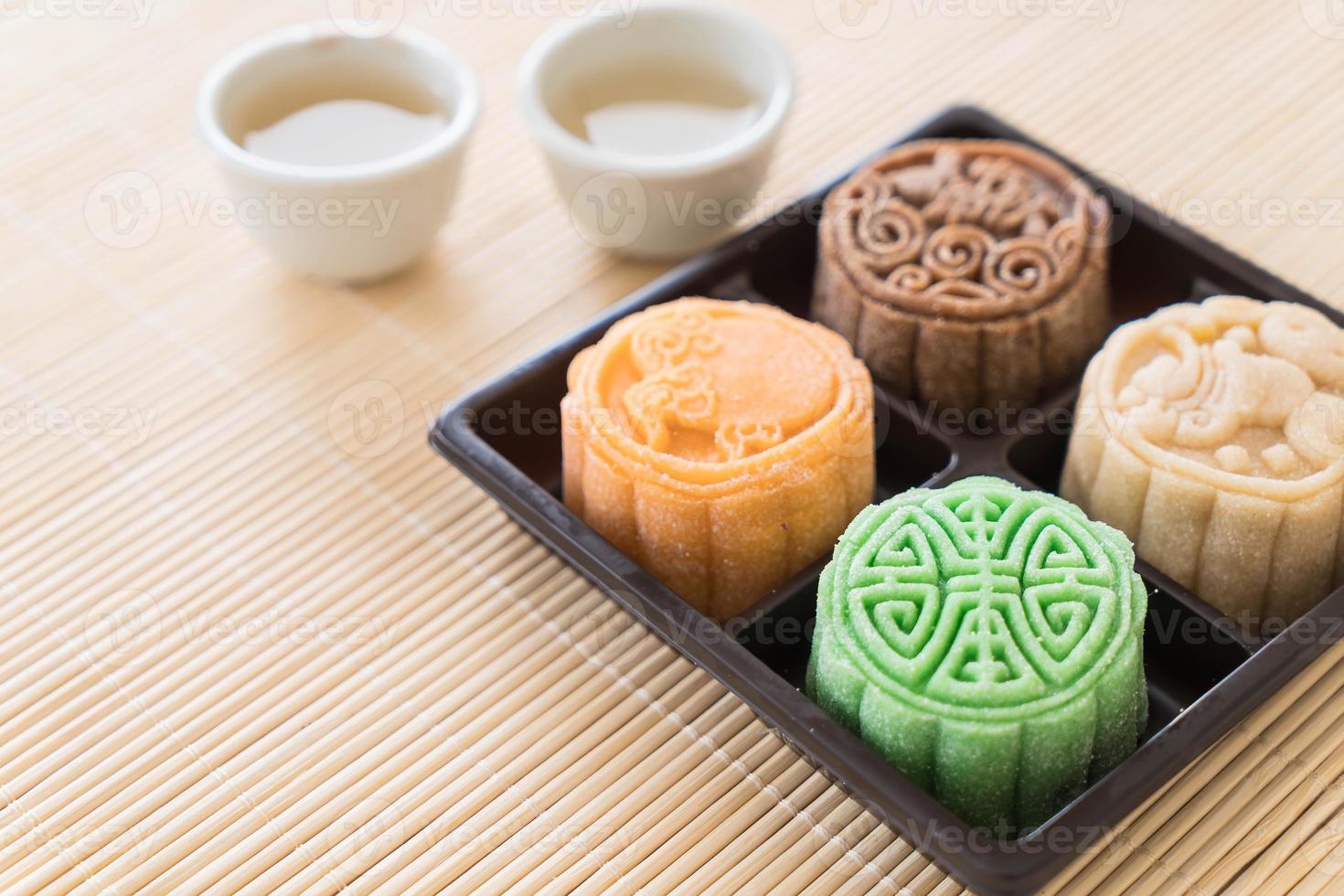 Fresh moon cake on wood plate photo