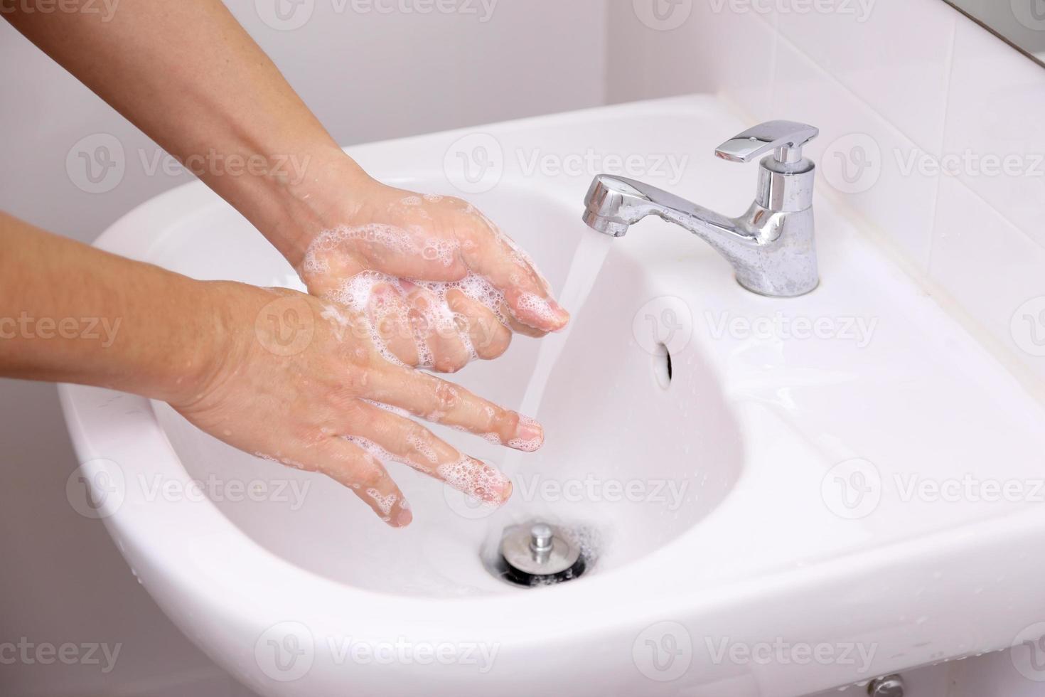 Washing Hands in The Sink photo