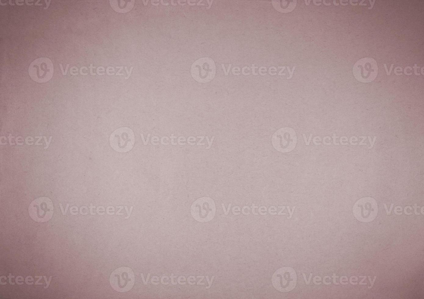 Old pink paper background with dark vignette. photo