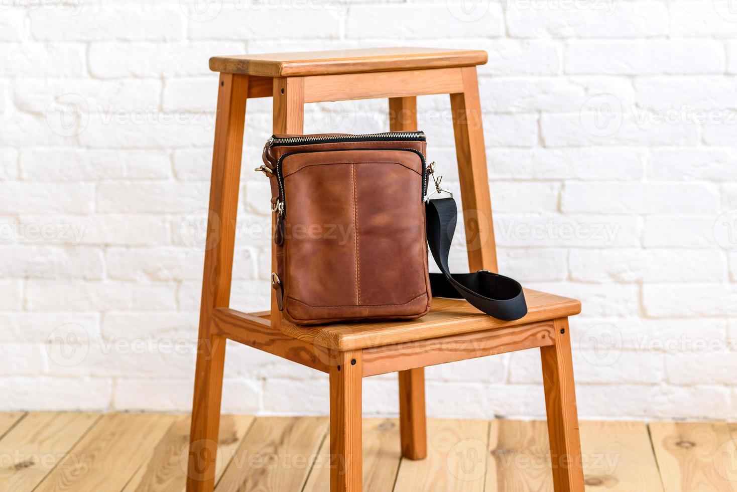 Beautiful brown bag made of leather designed for various items photo