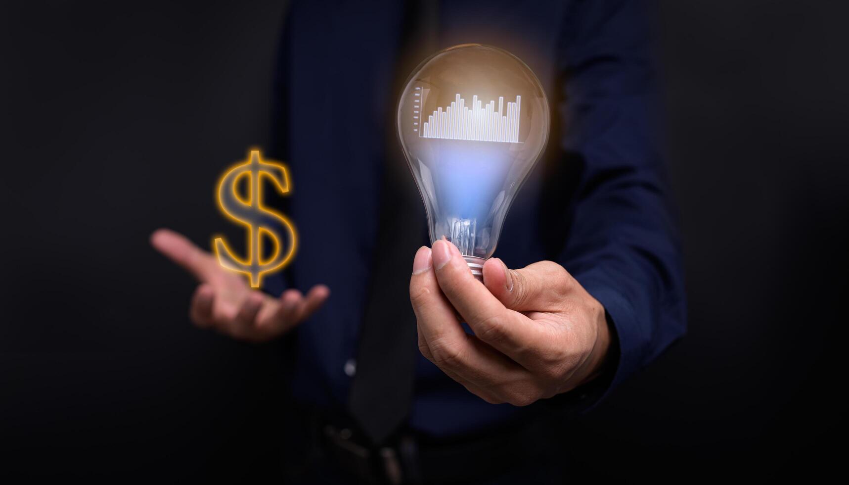 Handheld concept light bulb bar graph idea stock investment photo