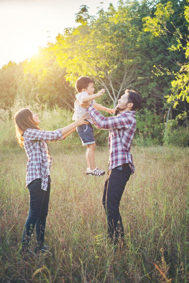 Happy young family spending time together outside. Family love concept photo