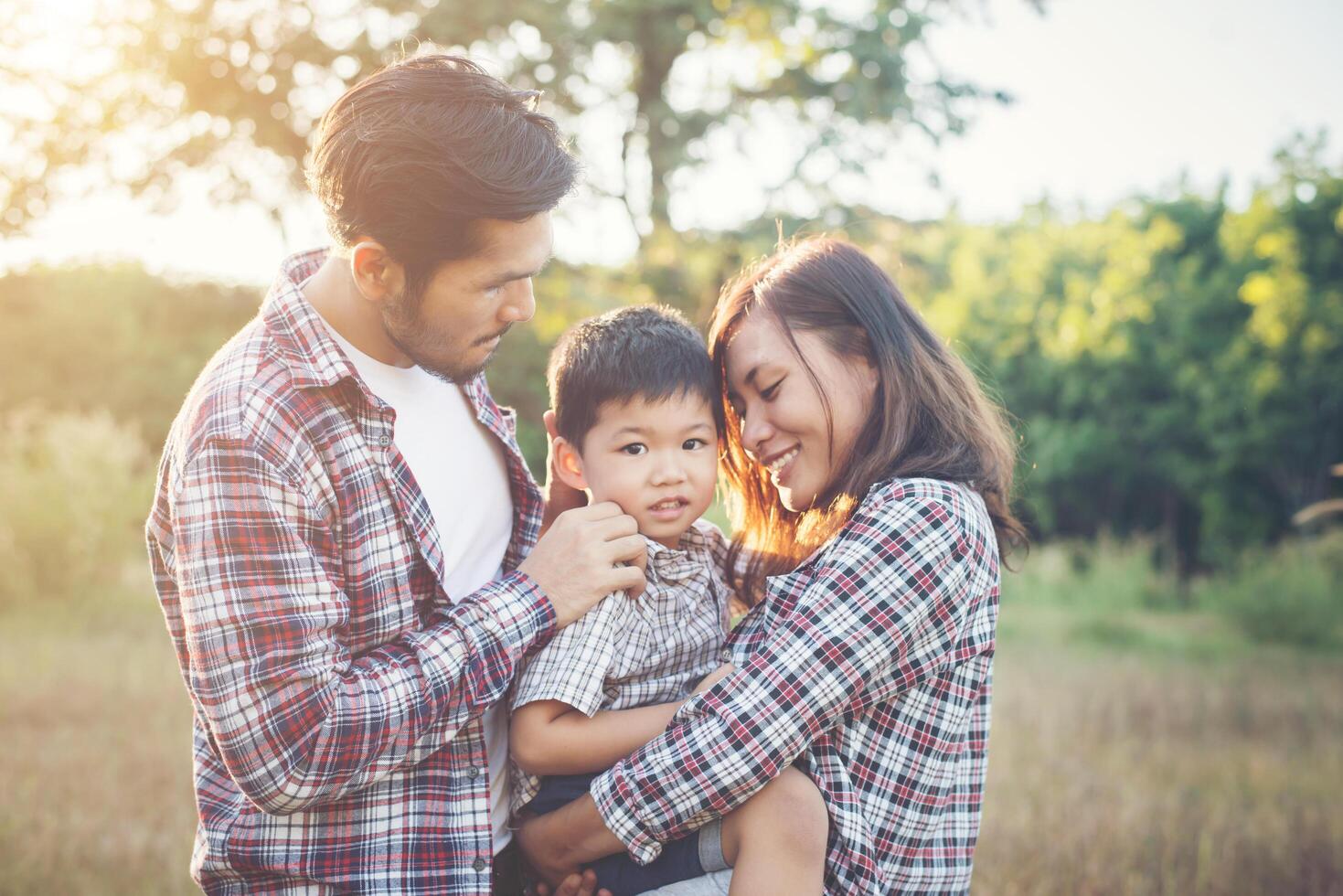 Happy young family spending time together outside. Family love concept photo