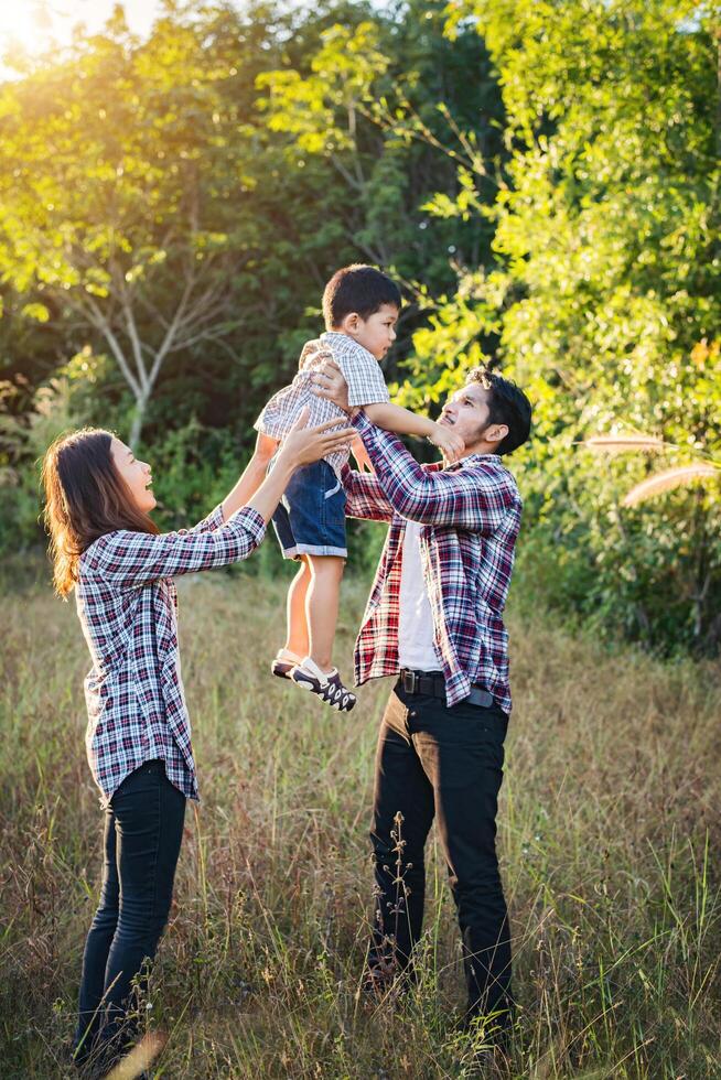 Happy young family spending time together outside. Family love concept photo