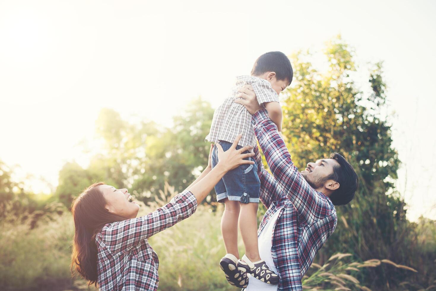 Happy young family spending time together outside. Family love concept photo