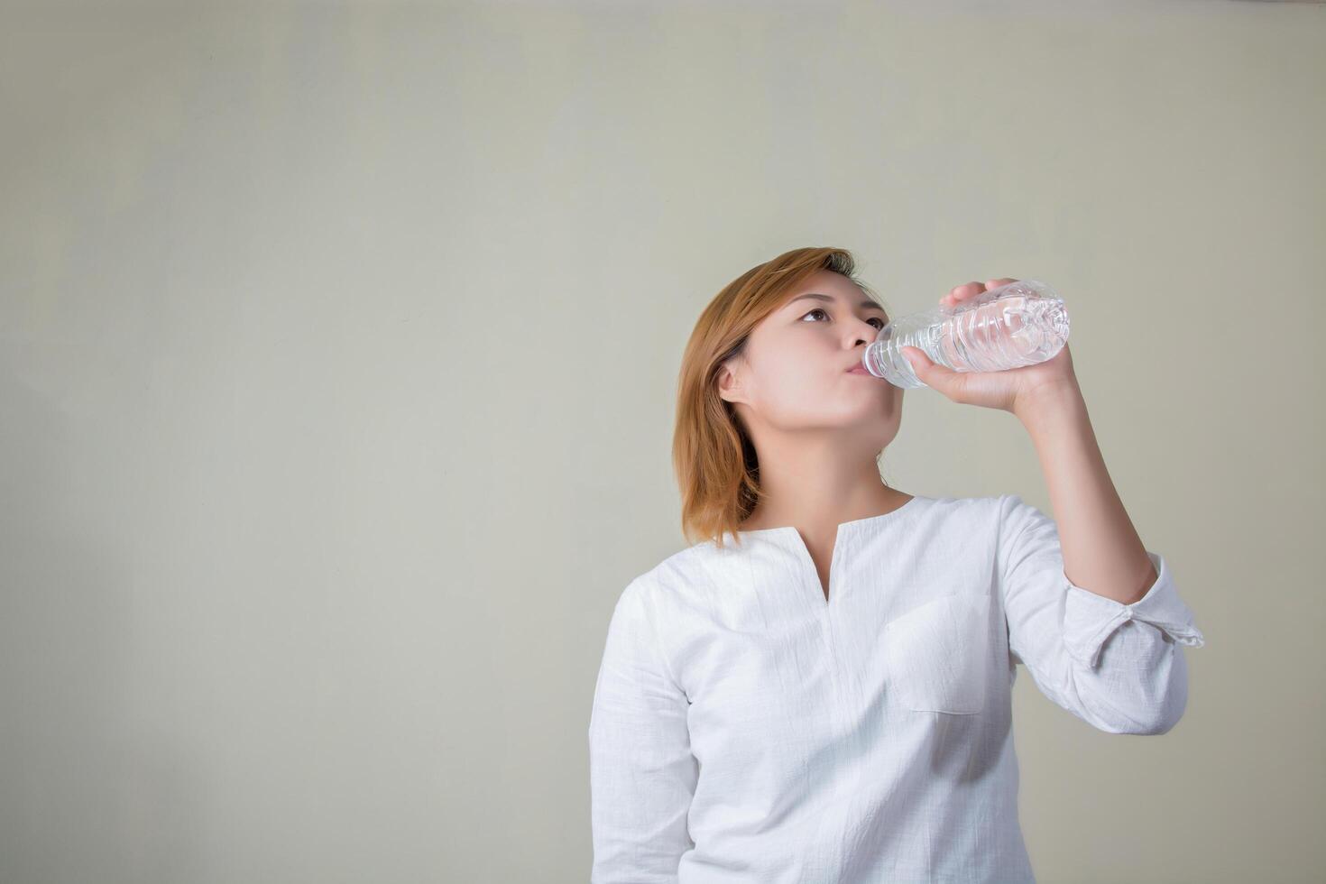 Young woman drinking water look so fresh photo