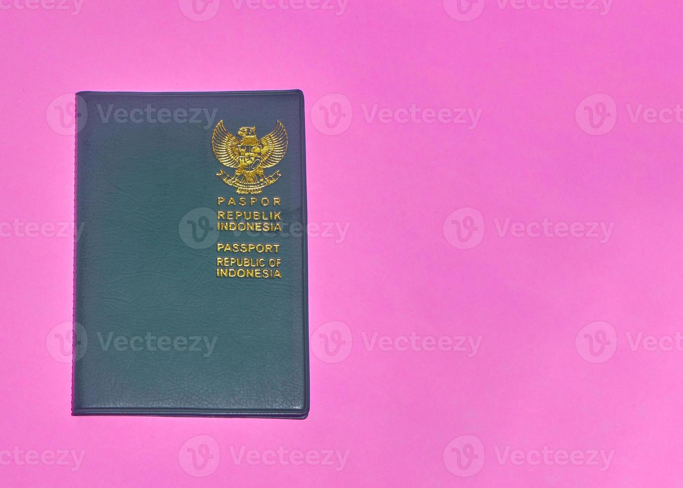 Photo of Indonesian passport on pink background