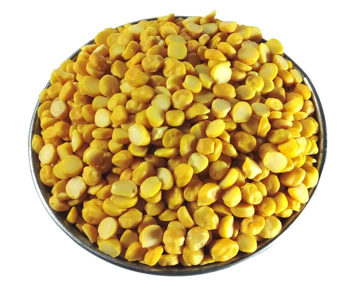 Pile of yellow peas in a bowl on a white background photo