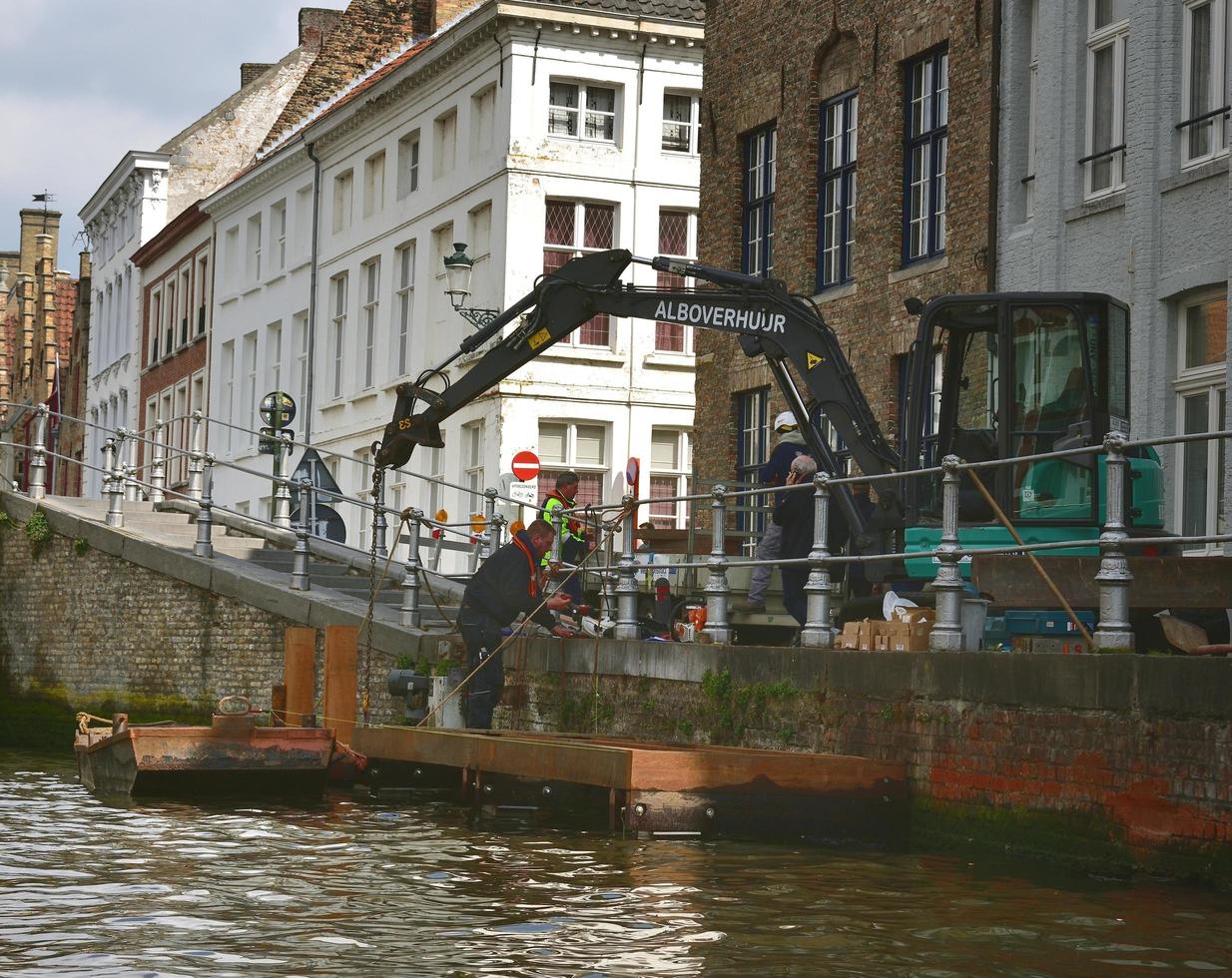 Bruges, Belgium - 29th April 2019, Construction works repairing the canal structure photo