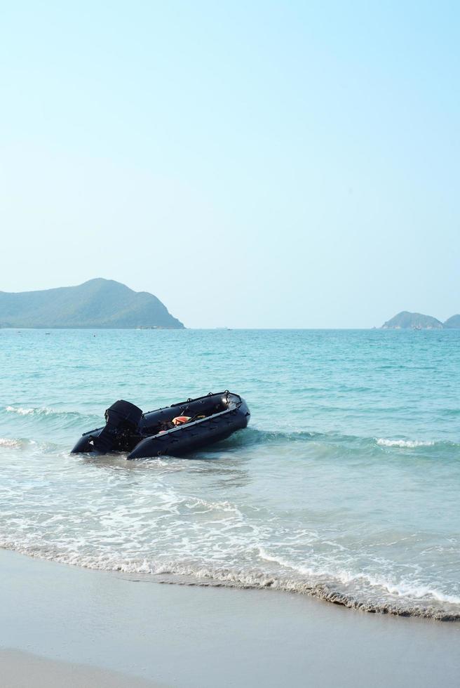 inflatable motor boat on the beach photo