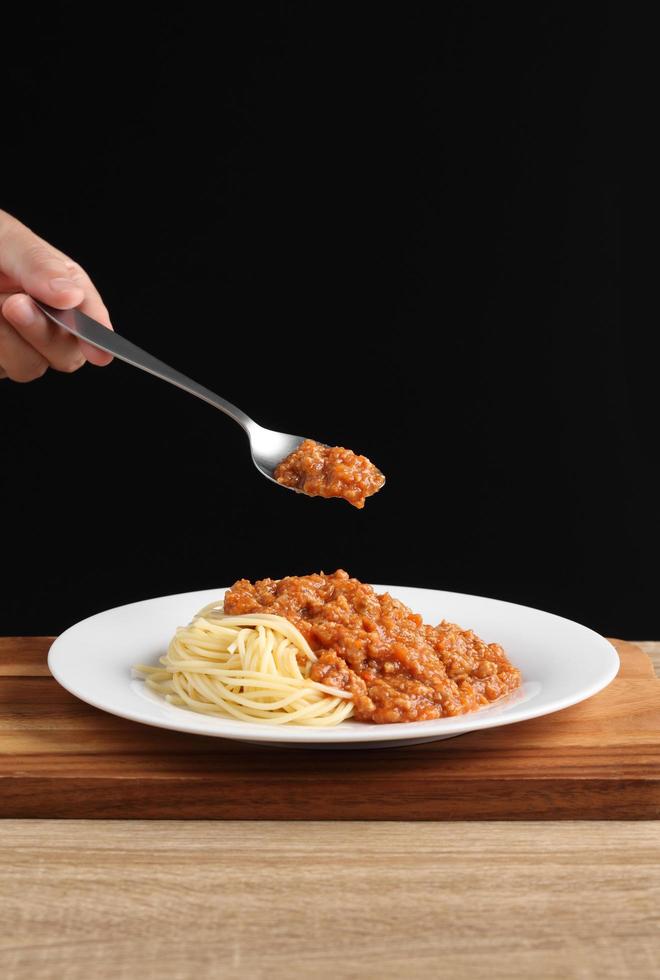 Food stylist use spoon decorating Italian food photo