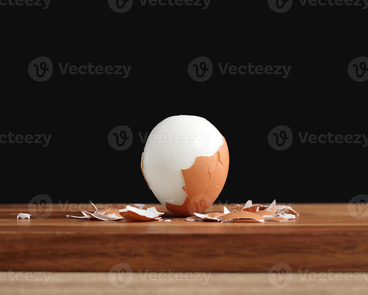 boiled egg on wooden cutting board photo