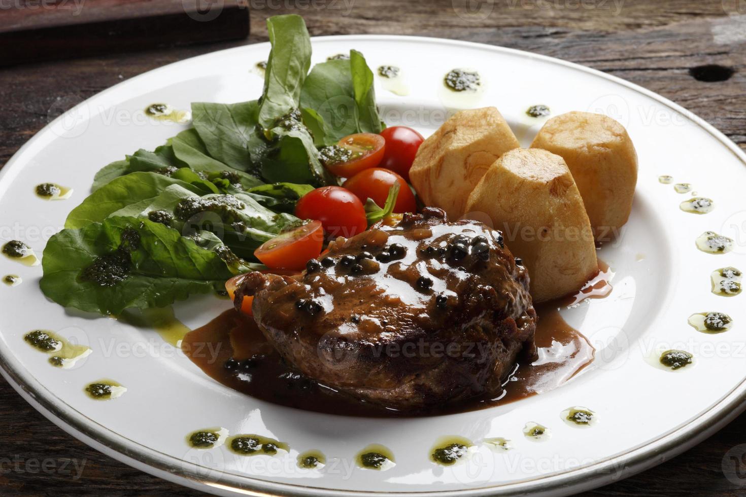 Roasted filet mignon with salad photo