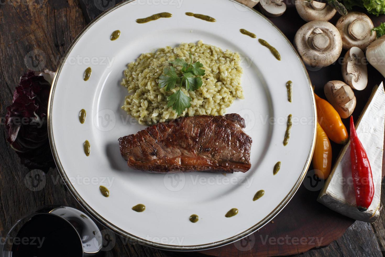 Risotto with meat and red wine photo