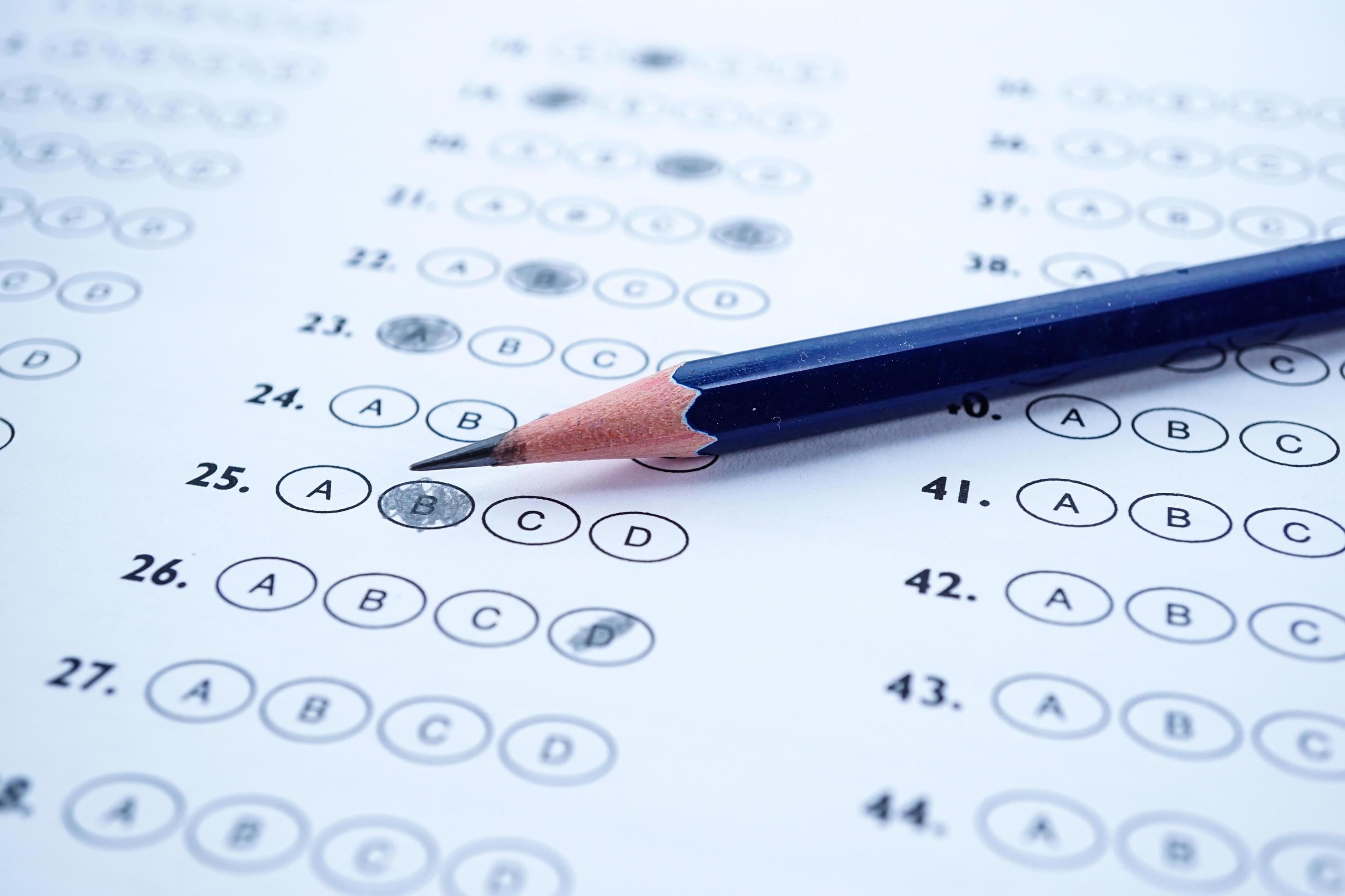 Pencil on multiple choice test paper. 3115048 Stock Photo at Vecteezy