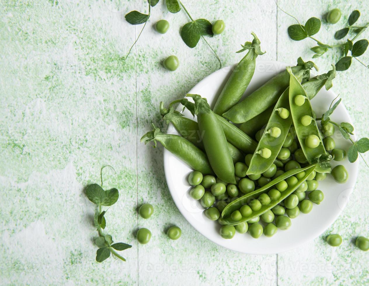 Fresh green peas pods and green peas with sprouts photo